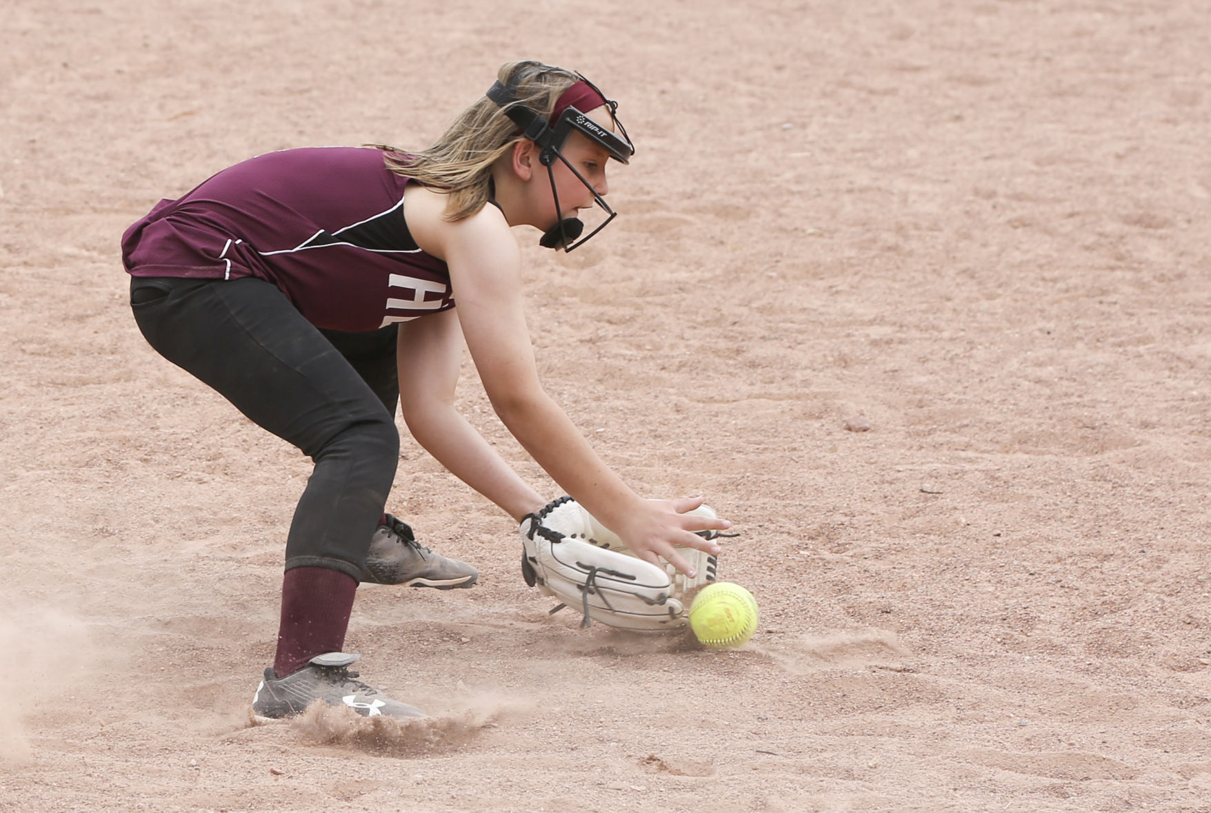 Buffalo third baseman Sydney Howe stops a ground ball before throwing to first
